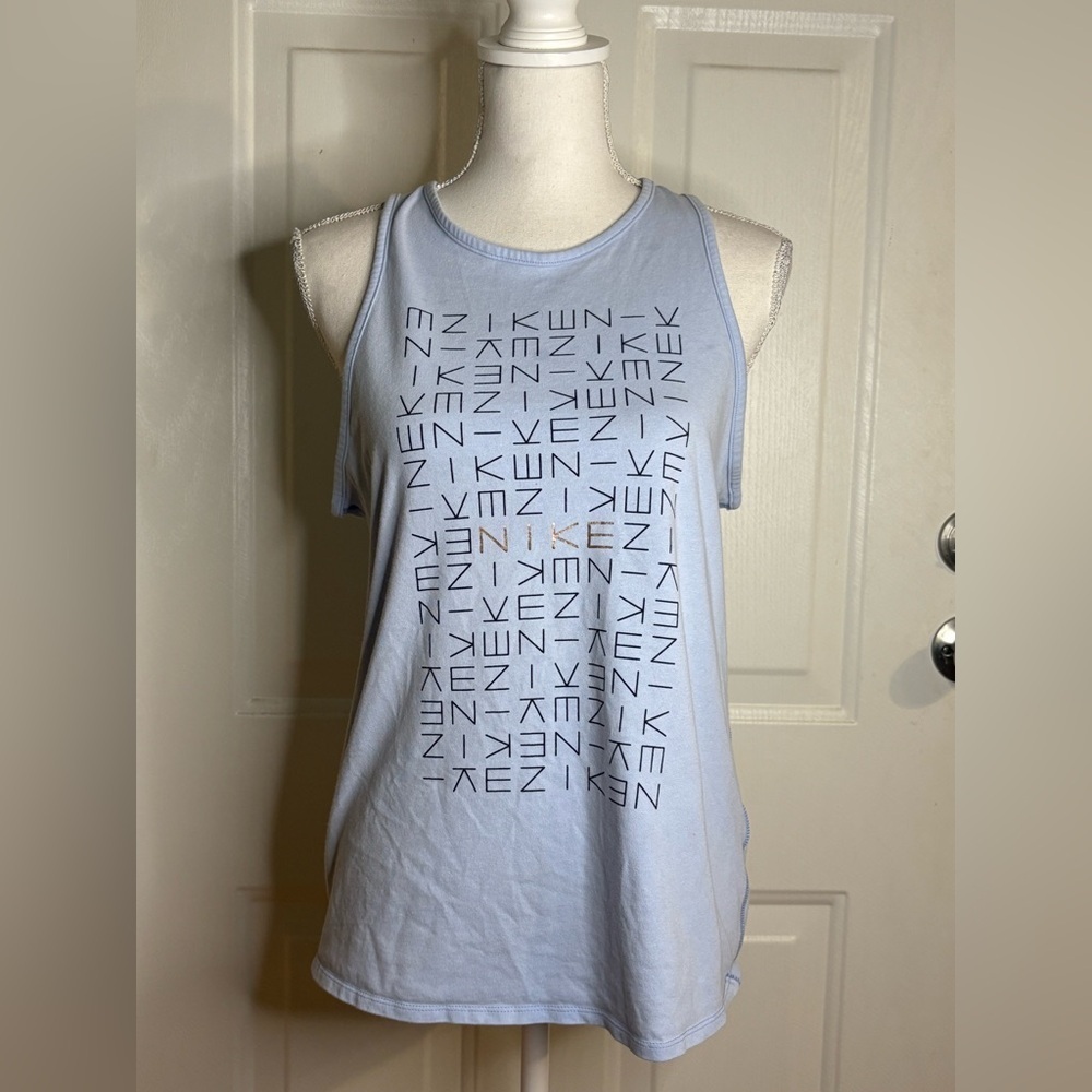 Nike light blue tank top with logo pattern. Size Medium.